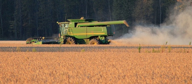 A combine harvests a crop