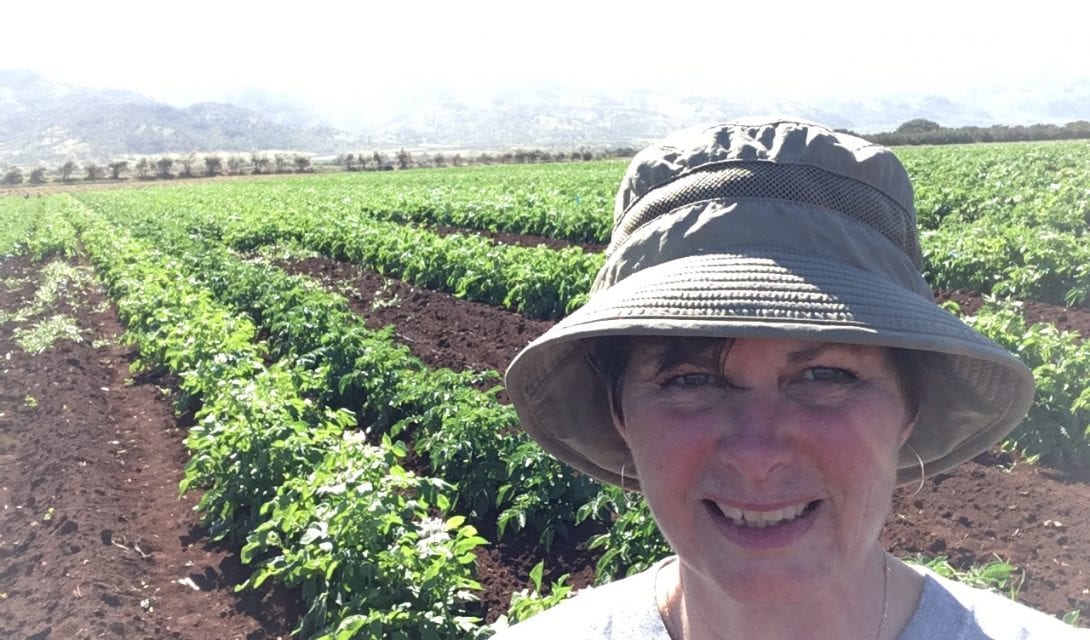 Deb Hart in a Hawaiin potato field